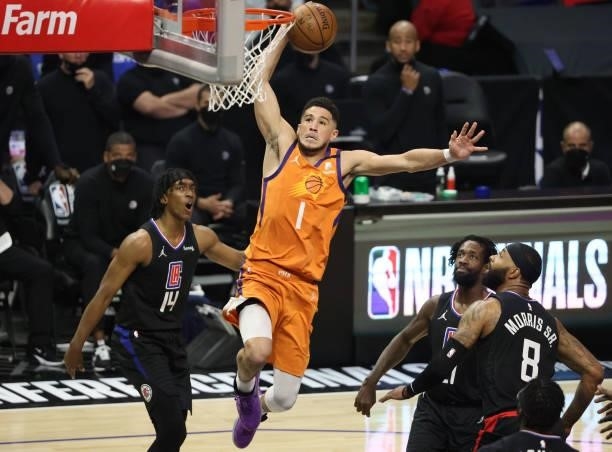 Devin Booker of the Phoenix Suns dunks against the LA Clippers during the first half in Game Six of the Western Conference Finals at Staples Center...