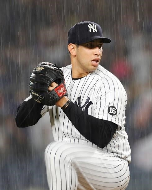 Luis Cessa of the New York Yankees pitches in the rain during the fifth inning against the Los Angeles Angels at Yankee Stadium on June 30, 2021 in...