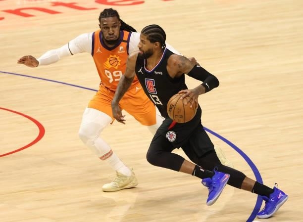 Paul George of the LA Clippers drives against Jae Crowder of the Phoenix Suns during the second half in Game Six of the Western Conference Finals at...