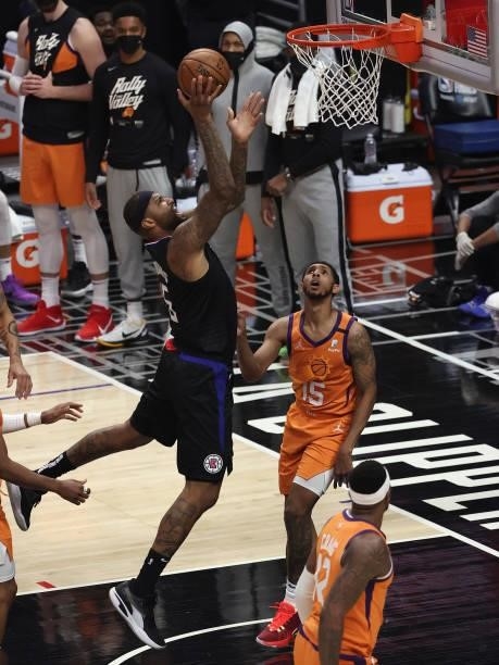 Marcus Morris Sr. #8 of the LA Clippers goes up for a shot against Cameron Payne of the Phoenix Suns during the second half in Game Six of the...