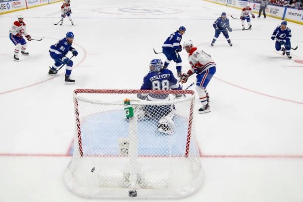 Andrei Vasilevskiy of the Tampa Bay Lightning reacts as a goal by Nick Suzuki of the Montreal Canadiens goes into the net during the second period in...