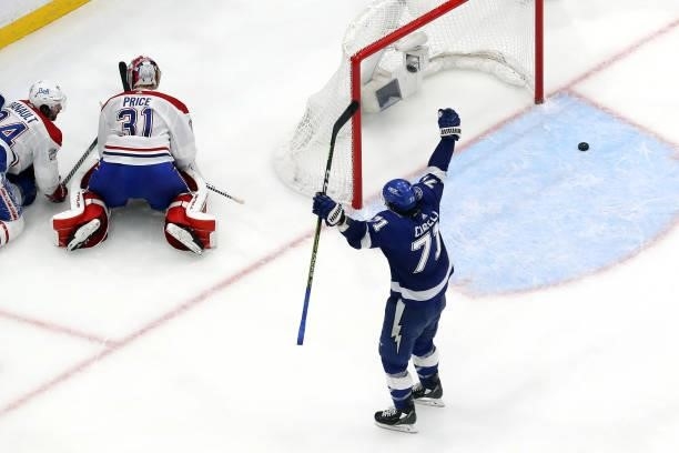 Anthony Cirelli of the Tampa Bay Lightning celebrates a goal by teammate Blake Coleman against Carey Price of the Montreal Canadiens during the third...