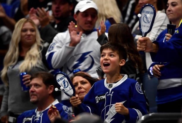 Young fan celebrates a goal by the Tampa Bay Lightning during the second period of Game Two of the 2021 Stanley Cup Final between the Montreal...
