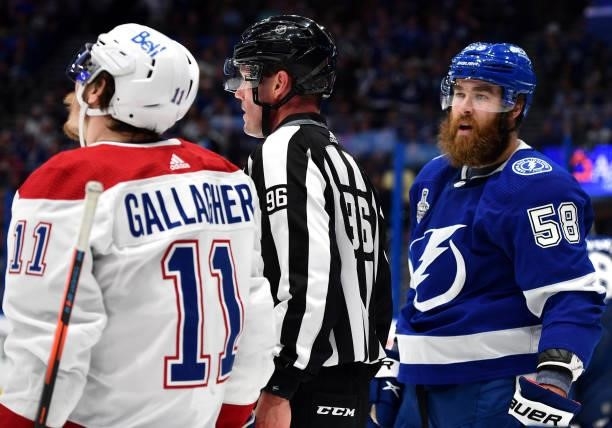 David Savard of the Tampa Bay Lightning yells to Brendan Gallagher of the Montreal Canadiens during the second period of Game Two of the 2021 Stanley...