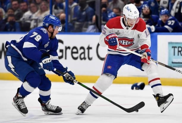 Ross Colton of the Tampa Bay Lightning controls the puck under Jesperi Kotkaniemi of the Montreal Canadiens during the second period of Game Two of...