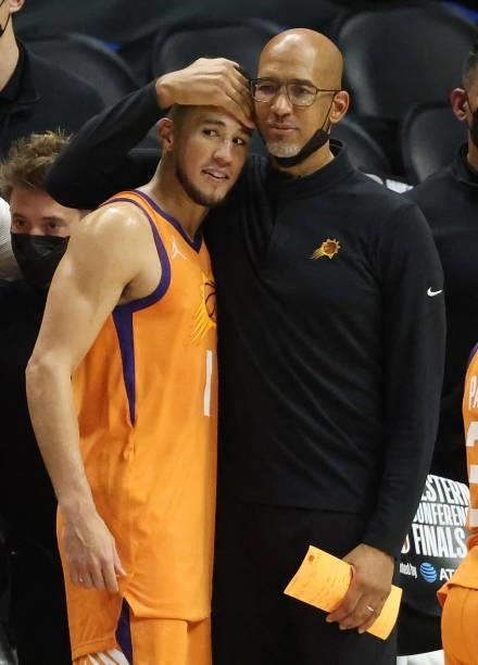 Head coach Monty Williams of the Phoenix Suns hugs Devin Booker in the final seconds of the team;s win against the LA Clippers during the second half...