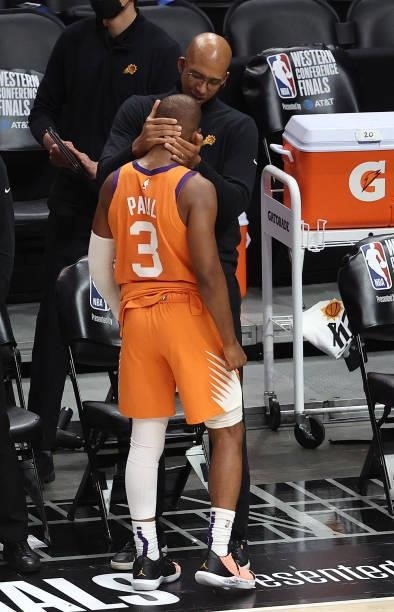 Head coach Monty Williams of the Phoenix Suns hugs Chris Paul in the final seconds of the team's win against the LA Clippers during the second half...