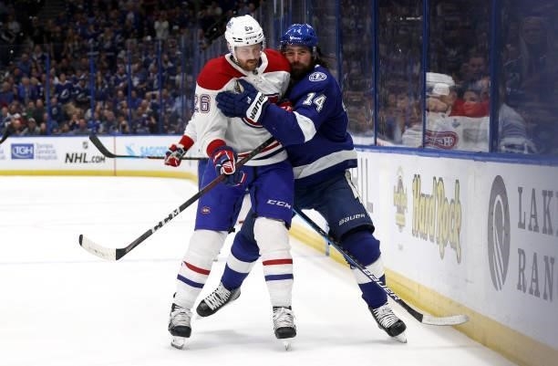 Jeff Petry of the Montreal Canadiens and Pat Maroon of the Tampa Bay Lightning collide during the second period of Game Two of the 2021 Stanley Cup...