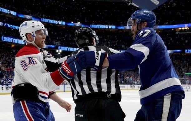 Corey Perry of the Montreal Canadiens is separated from Victor Hedman of the Tampa Bay Lightning during the third period of Game Two of the 2021...
