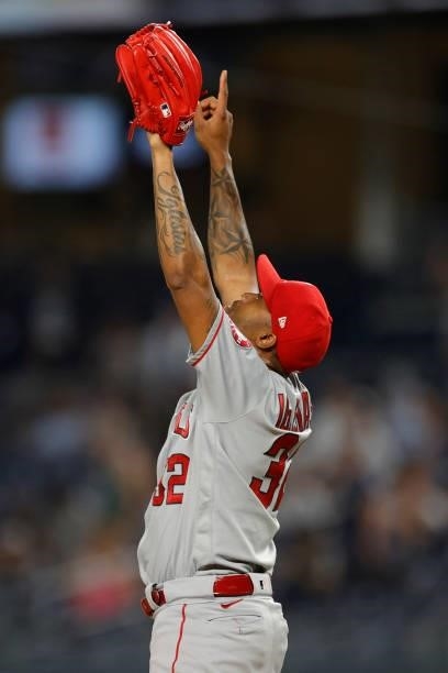 Raisel Iglesias of the Los Angeles Angels reacts after pitching the final out during the ninth inning against the New York Yankees at Yankee Stadium...