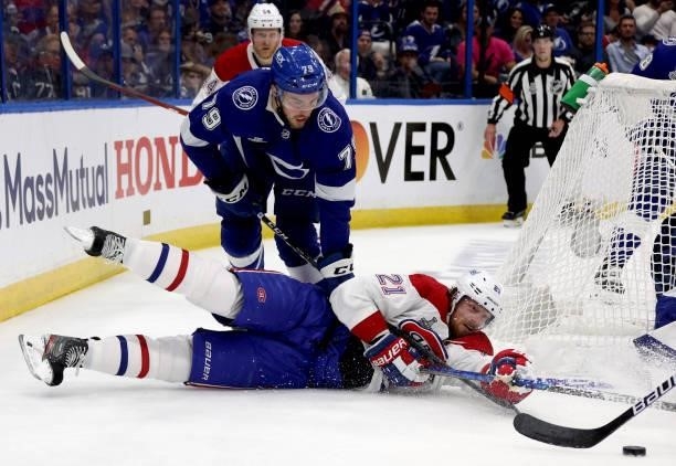 Eric Staal of the Montreal Canadiens goes down in front of Ross Colton of the Tampa Bay Lightning during the second period of Game Two of the 2021...