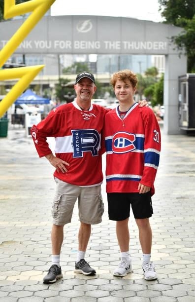 Jean-Paul and his son, from Michigan, wearing a jersey from Laval Rocket, pose outside of Amalie arena before Game Two of the 2021 Stanley Cup Final...