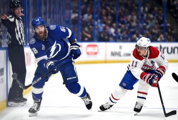 David Savard of the Tampa Bay Lightning controls the puck away from Brendan Gallagher of the Montreal Canadiens during the second period of Game Two...
