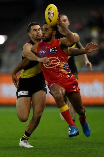 Touk Miller of the Suns chases the ball during the round 16 AFL match between the Gold Coast Suns and the Richmond Tigers at Marvel Stadium on July...
