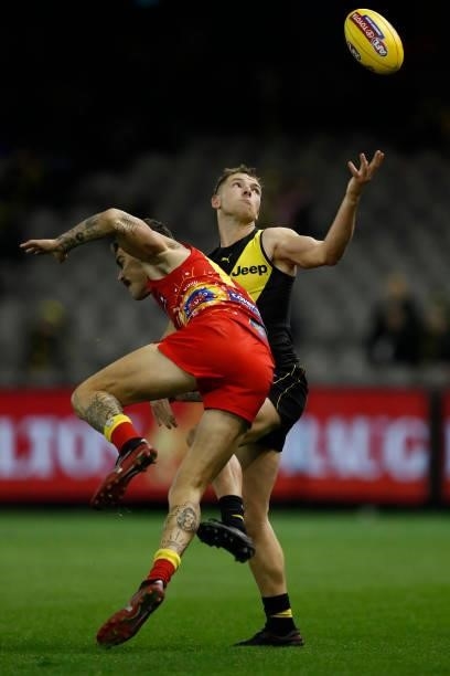 Oleg Markov of the Suns and Jake Aarts of the Tigers compete during the round 16 AFL match between the Gold Coast Suns and the Richmond Tigers at...