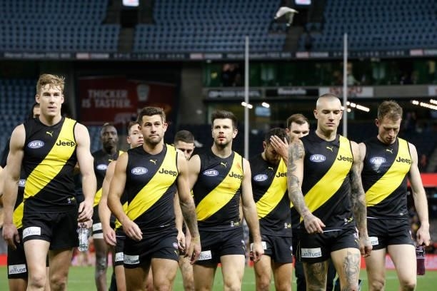 Dejected Richmond players walk from the ground after the round 16 AFL match between the Gold Coast Suns and the Richmond Tigers at Marvel Stadium on...