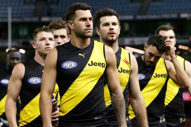Dejected Richmond players walk from the ground after the round 16 AFL match between the Gold Coast Suns and the Richmond Tigers at Marvel Stadium on...