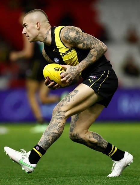 Dustin Martin of the Tigers gathers the ball during the round 16 AFL match between the Gold Coast Suns and the Richmond Tigers at Marvel Stadium on...