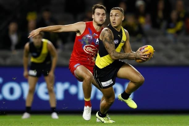 Shai Bolton of the Tigers runs with the ball during the round 16 AFL match between the Gold Coast Suns and the Richmond Tigers at Marvel Stadium on...