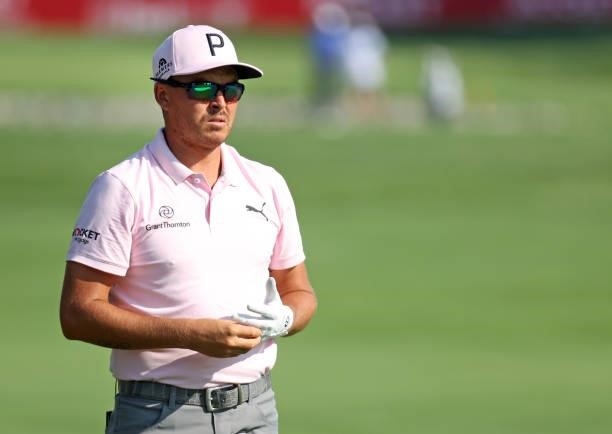 Rickie Fowler walks along the 16th fairway during the first round of the Rocket Mortgage Classic on July 01, 2021 at the Detroit Golf Club in...