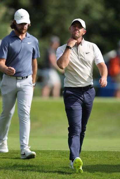 Tommy Fleetwood of England and Rory McIlroy of Northern Ireland walk down the 18th hole during Day One of The Dubai Duty Free Irish Open at Mount...
