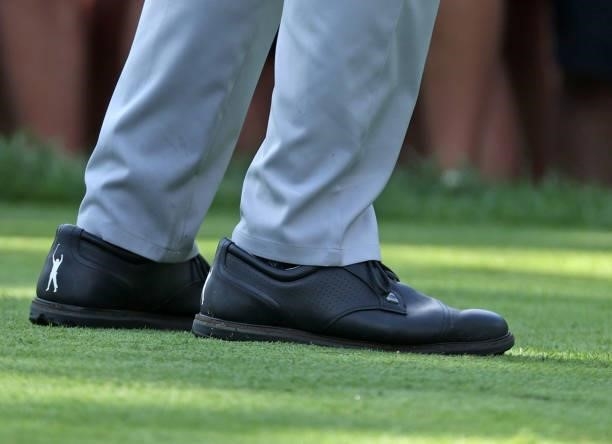 The shoes of Phil Mickelson as he prepares to play his shot from the fifth tee during the first round of the Rocket Mortgage Classic on July 01, 2021...