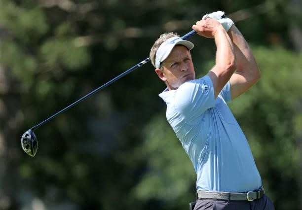 Luke Donald of England plays his shot from the fourth tee during the first round of the Rocket Mortgage Classic on July 01, 2021 at the Detroit Golf...