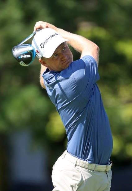 Adam Long plays his shot from the fourth tee during the first round of the Rocket Mortgage Classic on July 01, 2021 at the Detroit Golf Club in...