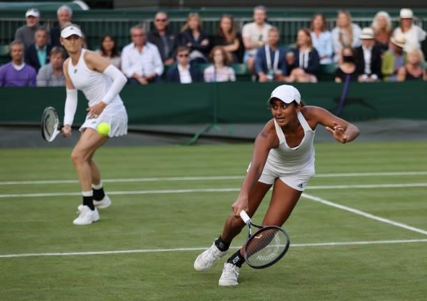 Naiktha Bains of Great Britain, playing partner of Samantha Murray Sharan plays a forehand during their Ladies' doubles first round match against...