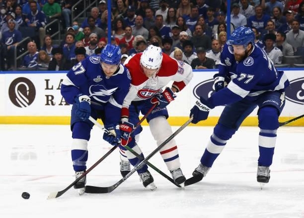 Corey Perry of the Montreal Canadiens skates against Yanni Gourde and Victor Hedman of the Tampa Bay Lightning in Game Two of the 2021 NHL Stanley...