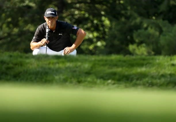 Gary Woodland lines up a putton the eighth green during the first round of the Rocket Mortgage Classic on July 01, 2021 at the Detroit Golf Club in...