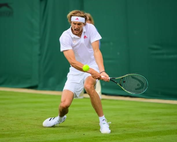 Alexander Zverev of Germany hits a backhand against Tennys Sandgren of the United States in the second round of the gentlemen's singles during Day...