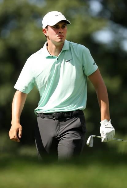 Davis Thompson plays his shot from the ninth tee during the first round of the Rocket Mortgage Classic on July 01, 2021 at the Detroit Golf Club in...