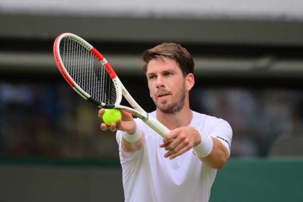 Cameron Norrie of Great Britain hits a backhand against Alex Bolt of Australia in the second round of the gentlemen's singles during Day Four of The...