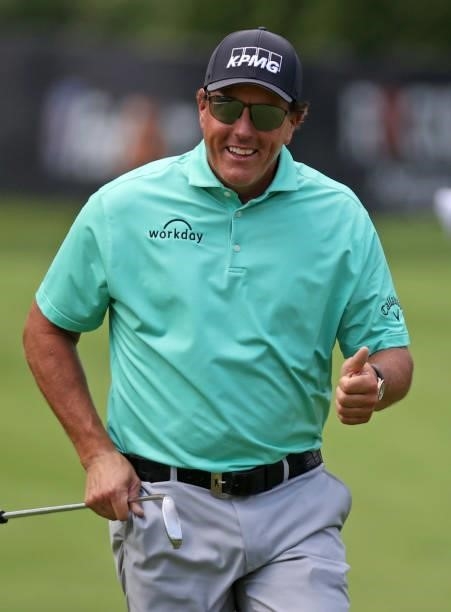 Phil Mickelson reacts to the crowd as he walks to the eighth hole during the first round of the Rocket Mortgage Classic on July 01, 2021 at the...