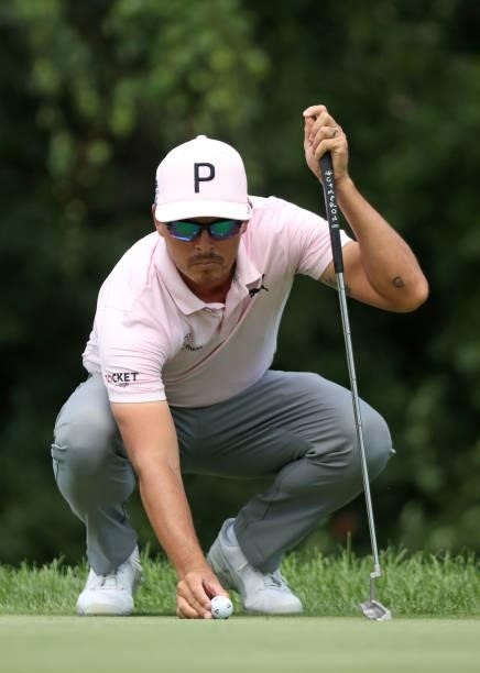 Rickie Fowler lines up a putt on the eighth green during the first round of the Rocket Mortgage Classic on July 01, 2021 at the Detroit Golf Club in...