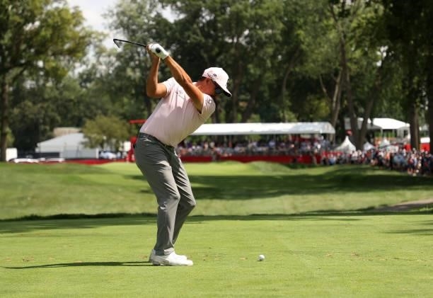 Rickie Fowler plays his shot from the ninth tee during the first round of the Rocket Mortgage Classic on July 01, 2021 at the Detroit Golf Club in...