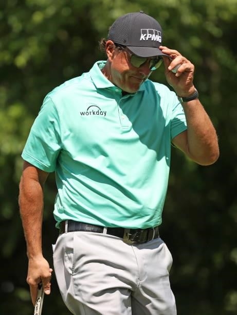 Phil Mickelson reacts to the crowd as he walks to the eighth green during the first round of the Rocket Mortgage Classic on July 01, 2021 at the...