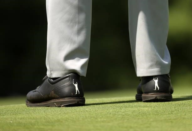 The shoes of Phil Mickelson as he prepares to play his shot from the fifth tee during the first round of the Rocket Mortgage Classic on July 01, 2021...