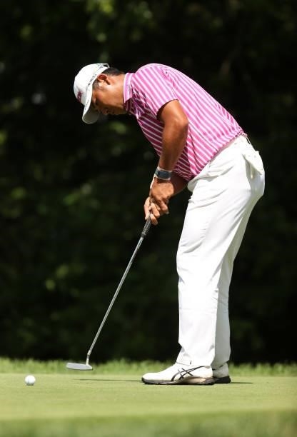 Hideki Matsuyama of Japan putts on the eighth green during the first round of the Rocket Mortgage Classic on July 01, 2021 at the Detroit Golf Club...