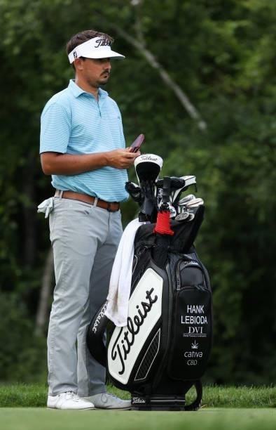 Hank Lebioda prepares to play his shot on the ninth tee during the first round of the Rocket Mortgage Classic on July 01, 2021 at the Detroit Golf...