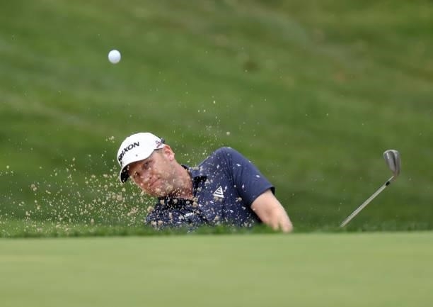 Ryan Brehm plays a shot from a bunker on the eighth hole during the first round of the Rocket Mortgage Classic on July 01, 2021 at the Detroit Golf...