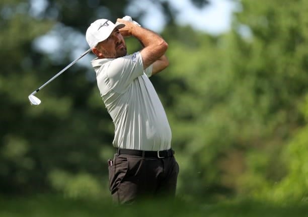 Rhein Gibson plays his shot from the ninth tee during the first round of the Rocket Mortgage Classic on July 01, 2021 at the Detroit Golf Club in...