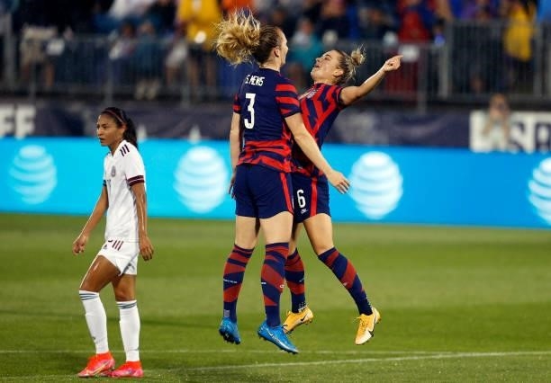 Samantha Mewis of the United States celebrates with Kristie Mewis after scoring a goal against Mexico at Rentschler Field on July 01, 2021 in East...