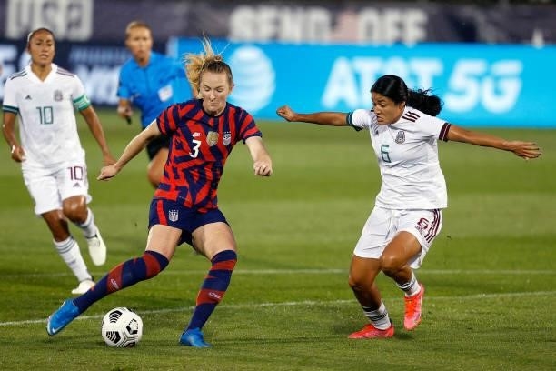 Samantha Mewis of the United States takes a shot on goal past Rebeca Bernal of Mexico to score during the first half at Rentschler Field on July 01,...