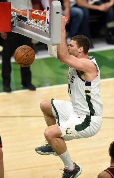 Brook Lopez of the Milwaukee Bucks dunks against the Atlanta Hawks during the first quarter in Game Five of the Eastern Conference Finals at Fiserv...