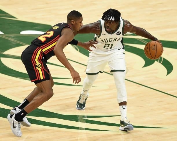 Jrue Holiday of the Milwaukee Bucks drives against Kris Dunn of the Atlanta Hawks during the first half in Game Five of the Eastern Conference Finals...