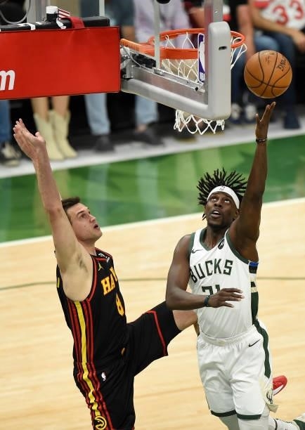 Jrue Holiday of the Milwaukee Bucks goes up for a shot against Danilo Gallinari of the Atlanta Hawks during the first half in Game Five of the...