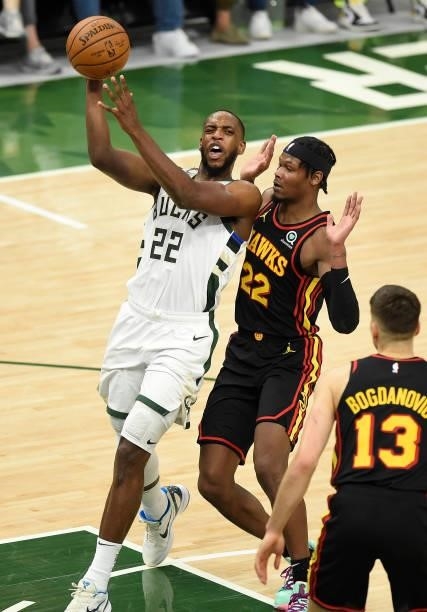 Khris Middleton of the Milwaukee Bucks drives to the basket against Cam Reddish of the Atlanta Hawks during the first half in Game Five of the...