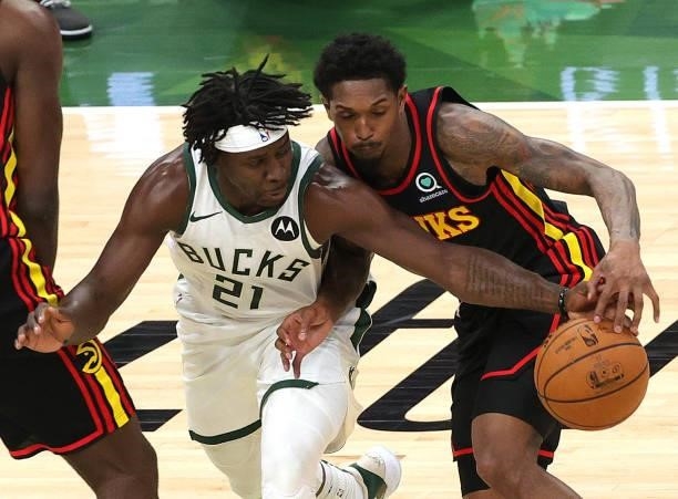 Jrue Holiday of the Milwaukee Bucks steals the ball form Lou Williams of the Atlanta Hawks during the first half in Game Five of the Eastern...